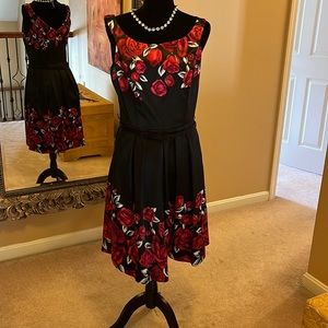 Flower power!  Stunning cocktail dress in black with large red roses.